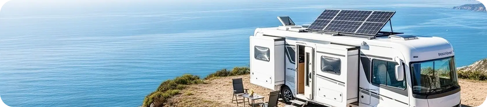Camper van with solar panels by the ocean